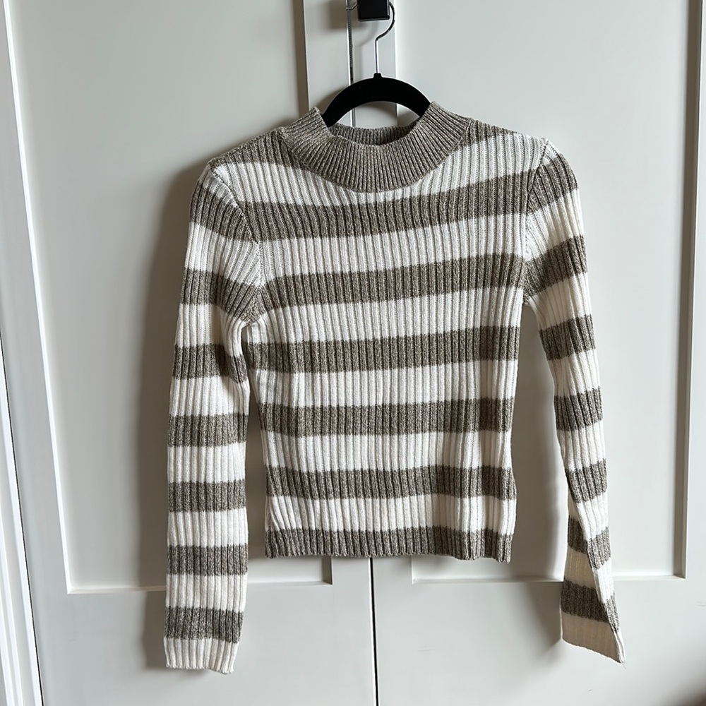 Grey and white striped fitted long sleeve sweater.